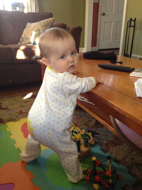 Practicing her standing...and her over-the-shoulder modeling looks.