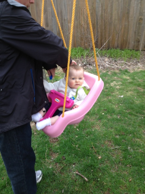 Getting ready for her first go in the swing...