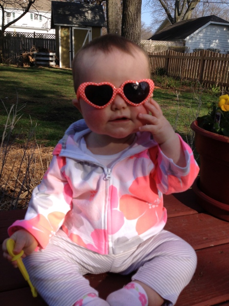 The future is so bright, she's gotta wear shades...for about 3 seconds before she pulls them off and sticks them in her mouth.